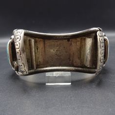 "VINTAGE WATCH CUFF BRACELET DESCRIPTION: This fabulous cuff features beautiful old specimens of turquoise and red Mediterranean coral, on a foundation of heavy gauge, hand-wrought sterling silver. This watch cuff bracelet will be a cherished addition to your collection of fine vintage Native American jewelry. MEASUREMENTS: Interior of the cuff measures 6\" with an additional 1 1/8\" non-adjustable gap. Total circumference: 7 1/8\" Measures 2 9/16\" straight across the widest part of the cuff (f Vintage Turquoise Bangle As A Gift, Vintage Turquoise Engraved Bracelets, Antique Turquoise Cuff Bracelet As Gift, Vintage Cuff Bracelet With Patina, Antique Turquoise Bangle Cuff Bracelet, Vintage Bangle Cuff Bracelet With Inlay, Vintage Turquoise Bangle Cuff Bracelet, Vintage Turquoise Bracelets With Inlay, Vintage Turquoise Bracelet With Inlay