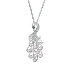 This lab-created white sapphire peacock pendant set in sterling silver features 2.0mm lab-created pink sapphires and an enhanced black diamond accented eye. The pendant suspends along an 18.0-inch rope chain that secures with a spring-ring clasp. Pink Cubic Zirconia Round Pendant Jewelry, Pink Cubic Zirconia Round Pendant, Fine Jewelry Pink Teardrop Pendant, Pink Pendant Jewelry With Diamond Accents, Pink Teardrop Pendant Fine Jewelry, Pink Sterling Silver Necklace With Diamond Accents, Zales Zales, Peacock Pendant, Sapphire Stone