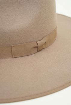 The Barry hat from Olive & Pique is a classic wool felt rancher hat featuring a tonal satin lining, hard brim and adjustable sizing. Brand: Olive & Pique Classic wool felt rancher Tonal satin lining Inner circumference: 58/59cm with an adjustable inner drawstring for sizing Brim length: 9.5cm, Crown height: 10cm ABOUT OLIVE & PIQUE Founded in 2000 and originally based out of Nu'uanu on the island of O'ahu, Hawai'i, what started as an artistic outlet for owner, Pri, has evolved into a revered hea Fall Flat Brim Top Hat, Classic Boater Hat With Flat Brim For Fall, Classic Wide Brim Boater Hat For Fall, Adjustable Fur Felt Boater Hat For Fall, Fall Fur Felt Boater Hat With Flat Brim, Classic Beige Panama Hat For Winter, Beige Wide Brim Boater Hat For Fall, Wool Boater Hat With Flat Brim For Fall, Solid Flat Brim Top Hat For Fall