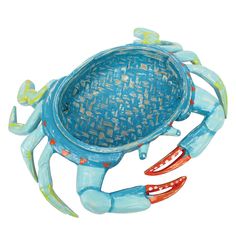 a blue crab shaped dish with red claws on it's back and legs, in front of a white background