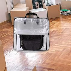 a bag sitting on the floor in front of moving boxes