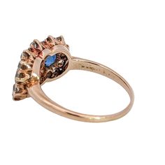 Era: c. 1895-1905 Metal: 18K Yellow Gold & Platinum Sapphires: 1.80 Carats Total Weight of Yogo Gulch Montana Sapphires (GIA *5923) Diamonds: 1 Carat Total Weight Size: 8.25 Victorian Gold Sapphire Ring With Diamond, Victorian Sapphire Ring With Diamond In Gold, Heirloom Yellow Gold Cluster Ring With Multi-stone, Antique Multi-stone Yellow Gold Cluster Ring, Antique Multi-stone Cluster Ring In Yellow Gold, Victorian Style Gold Opal Ring With Multi-stone, Formal Heirloom 14k Stamped Opal Ring, Classic Yellow Gold Topaz Ring With Multi-stone, Antique Formal Cluster Ring With Gemstone