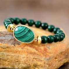 Magic Malachite Stone Bracelet Stretch Immerse yourself in the mystical allure of our Magic Malachite Stone Bracelet a beautiful bracelet in the realm of handmade natural stone jewelry. Adorned with a vibrant malachite charm in an array of green tones, this stretchable bracelet is designed to add a touch of magic to your everyday style. Benefits of Malachite: Beyond its beauty, malachite is believed to bring protection, transformation, and healing energy. Wearing the Magic Malachite Stone Bracel Amethyst Crystal Bracelet, Malachite Bracelet, Bracelet Apple Watch, Rose Quartz Bracelet, Malachite Stone, Couple Jewelry, Natural Stone Jewelry, Yoga Jewelry, Unique Gemstones