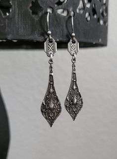 Adorn yourself with these antique silver plated drop earrings with a beautifully detailed metalwork. These earrings are 1 3/4 inches long.  Stainless steel earwires.  Lightweight  All my jewelry is free of lead, free of nickel and made in the USA.  Eco friendly metals .    I source all materials from the USA, Italy, Portugal, Spain and The United Kingdom.  All my jewelry is designed for you to express yourself and your life with a soulful and meaningful purpose. Silver Chandelier Earrings With Intricate Design For Formal, Vintage Antique Silver Dangle Earrings, Ornate Antique Silver Nickel-free Jewelry, Classic Silver Chandelier Earrings, Elegant Engraved Metal Earrings, Classic Silver Chandelier Earrings For Pierced Ears, Vintage Silver Chandelier Earrings, Antique Silver Engraved Earrings For Gift, Antique Silver Engraved Earrings Gift