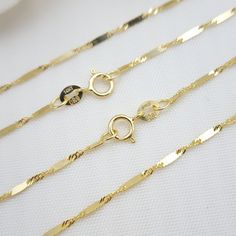 💓 One of the shiniest chains in the jewelry district. The beautiful singapore bar chain is crafted in 14k yellow Gold. This amazing chain will make everyone glance at you. Perfect for everyday and every occasion. Shiny, elegant and unique. 14k gold will not tarnish or rust  💓 Materials: 14k solid yellow gold Size: 16 inches/ 18 Inches / 20 Inches / 22 Inches / 24 Inches  Weight: 1.5 grams / 1.65 grams / 1.85 grams / 2 grams/ 2.2 grams Thickness: 1.4mm 14k gold stamped  Spring ring lock  💓 Bri 16 Inch 14k Gold Chain Necklace For Gift, 14k Gold 16 Inch Chain Necklace As Gift, 14k Yellow Gold Chain Necklace 16 Inch, Gold 14k Chain Necklace, 14k Gold Chain Necklace, 16 Inch Length, 16 Inch 14k Gold Chain Necklace, Singapore Bar, Dainty Chain, 14k Gold Necklace