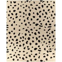 an animal print rug with black spots on it's sides and a beige background