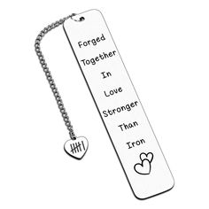 an engraved bookmark with two hearts and the words forget together in love, stronger than iron