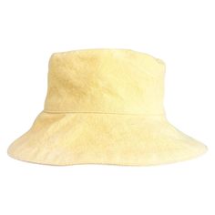 Our beautiful bucket canvas hats are hand made with upcycled cotton and post-industrial textile waste. This process is chemical-free, dye-free, and uses minimal water and energy. No synthetic fibers are added to the fabric, making it 100% natural and compostable. The canvas is sent to a small women-owned studio in Guatemala for the final phase of production. This studio was founded on conscious manufacturing principles with a heavy emphasis on the individual, fair wages, the environment, and red Yellow Bucket Hat, Avocado Seed, Canvas Hat, Textile Waste, Hat Ideas, Small Women, Fabric Making, Dye Free, Chemical Free