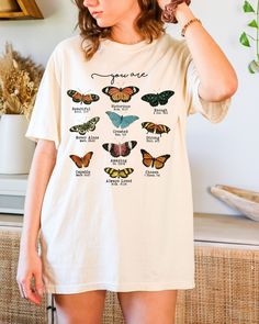 D E S I G N Super trendy butterfly bible verse tee!  The soft-washed, garment-dyed fabric brings extra coziness to your wardrobe while the relaxed fit makes it an excellent daily choice.  Comfort Colors Unisex Garment-Dyed T-shirt S I Z I N G Please refer to the SIZE CHART in the listing photos to ensure you get the perfect fit. S M L XL XXL XXXL D E T A I L S Brand - Comfort Colors Relaxed fit Midweight Tee Pre-shrunk fabric Solid Colors: 100% combed and ring-spun cotton -direct-to-garment or DTG printing used for most of our apparel products -DTG printing yields quality prints -DTG inks are eco-friendly, CPSIA-compliant, non-toxic, non-hazardous, and soluble in water Machine wash cold, inside-out, gentle cycle with mild detergent and similar colors. No fabric softeners. Tumble dry low, o Bible Verse Tees, Boho Christian, Christian Merch, Butterfly Shirt, Water Machine, Butterfly Shirts, Christian Shirt, Dtg Printing, Dyed Fabric