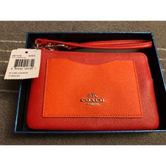 Red & Orange Coach Wristlet. Never Used! Can Fit Iphone Xs. Comes With Original Coach Gift Box. Red Wristlet With Removable Pouch As Gift, Red Wristlet With Removable Pouch For Daily Use, Red Wristlet With Removable Pouch For Travel, Red Wristlet With Wrist Strap For Travel, Red Wristlet With Wrist Strap For Daily Use, Red Wallet With Wrist Strap For Daily Use, Red Rectangular Wristlet For Travel, Red Travel Wristlet With Wrist Strap, Red Rectangular Wristlet With Wrist Strap