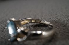 I am offering you this vintage sterling silver Art Deco style band ring with a gorgeous prong set trillion triangle shaped, genuine blue topaz stone. There is a regal influence in the design here, very nice! There is fabulous design setting. It measures app. 3/4 inch, by app. 1/4 inch. It has color saturation and intensity that is endless, as seen in the provided pictures. What an eye catcher! It has the classic highly desired solid setting that is very thick and substantial, giving this ring al Formal Trillion Cut Topaz Ring In Fine Jewelry Style, Formal Trillion Cut Topaz Fine Jewelry Ring, Silver Trillion Cut Sapphire Ring, Silver Trillion-cut Birthstone Ring, Silver Trillion Cut Ring With Birthstone, Silver Trillion Cut Birthstone Ring, Formal Trillion-cut Birthstone Ring, Vintage Silver Topaz Birthstone Ring, Trillion Cut Silver Jewelry For Formal Occasions