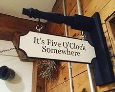 there is a sign that says it's five o'clock somewhere on the wall