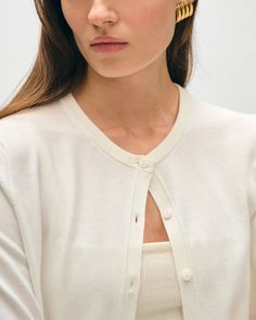 Indulge in the luxurious comfort of the White + Warren Cotton Linen Cardigan in White. Crafted from a soft and breathable blend, this cardigan features delicate ribbing and three elegant buttons down the front. Perfect for any occasion, wear it alone or paired with a tank top for a complete and sophisticated look. THIS ITEM IS FINAL SALE. AS WE PREPARE TO CLOSE OUR DOORS AT THE END OF THE YEAR, PLEASE NOTE THAT ALL SALES ARE FINAL AND NOT ELIGIBLE FOR PRICE ADJUSTMENTS AT A LATER DATE. Linen Cardigan, Frank & Eileen, Clare V., Sophisticated Look, Active Wear Shorts, White Cardigan, Ulla Johnson, Trending Now, Tank Dress