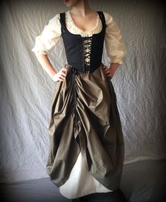 "A complete costume ready for the fair! This listing includes the full ensemble; the skirt, 3/4 chemise, and corset. By purchasing this full set, you are getting a savings of 10% off for ensemble pricing! This versatile ensemble is period correct for the early 18th century, colonial, and baroque eras or, ideal for any Renaissance Faire festivities. See our full line of festival wear here: www.periodcorsets.com/festival-wear -THE CORSET BODICE is made of two layers: a plain Kona cotton fabric, yo Ren Faire Outfits, Corset And Skirt, Ren Faire Costume, Fair Outfits, Fest Outfits, Peasant Skirt, Festival Skirts, Corset Bodice, Kona Cotton