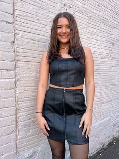 our 'late nights bustier top' is an edgy corset style top. this black leather top is sure to spice up your look in seconds. it features a square neckline and a ruched stretchy material in the back for comfort. shop our dressy tops here! sizing, details & care sizing::model, Holley is 5'3" 125lbs wearing a size small details::92% polyester, 8% spandex care::dry clean only Black Leather Top, Corset Style Tops, Small Details, Bustier Top, Dressy Tops, Small Detail, Corset Style, Square Necklines, How To Make Notes