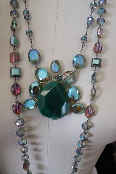 "Wedding necklaces, evening jewelry in crystal & glass. 3 colors to choose from, blue crystal, & purple crystal & Greeen glass combination. measures about 21 inches -one way. these are stunning in person. If you want several necklaces I will adjust the \"per piece\" price https://www.facebook.com/pg/RetroVintageWeddings1920s1930s/photos/?tab=album&album_id=2712728162156543" Iridescent Jeweled Jewelry For Parties, Elegant Iridescent Crystal Jewelry, Evening Costume Jewelry With Faceted Beads, Costume Jewelry With Faceted Beads For Evening, Faceted Crystal Jewelry For Parties, Elegant Handmade Iridescent Crystal Necklace, Party Crystal Jewelry With Faceted Details, Vintage Green Crystal Jewelry, Jeweled Glass Jewelry For Parties