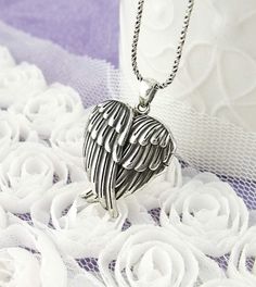 Heart-Shaped Folded Angel Wings Locket - woot & hammy Spiritual Winged Sterling Silver Jewelry, Silver Winged Engraved Jewelry, Silver Engraved Wing-shaped Jewelry, Winged Engraved Jewelry For Gifts, Silver Angelic Jewelry For Gift, Angelic Silver Jewelry For Gift, Engraved Winged Sterling Silver Jewelry, Engraved Wing-shaped Silver Jewelry, Engraved Wing-shaped Jewelry Gift