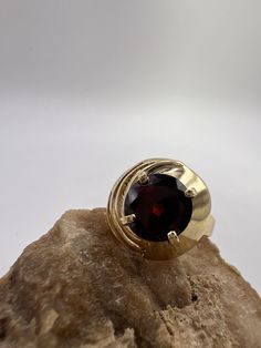 Designed and crafted by the owners and operators of the Miner's Emporium Jewelry Store Located in Rocky Mount, NC. This 14K, yellow gold ladies ring was handmade by Scot Slep, master jeweler of The Miner's Emporium. The ring contains a 1.75 ct genuine Pyrope Garnet.  *Gift Ideas* This gorgeous ring is the perfect gift for any special occasion, or just because! *Unique Piece* This item is a unique creation, so once stock is gone, it's gone! *Sizing Options* This ring is available to be sized by the jewelers at the Miner's Emporium. [Sizing Down] - $35.00 [Sizing Up] - $35.00 for first size up, $10.00 per additional size up. *Specifications* [Band Material] - 14K Yellow Gold [Gemstone] - Genuine Pyrope Garnet (1.75 ct) [Total Ring Weight] - 4.4 Grams [Finger Size] - 6 *We Appreciate You!* By Rocky Mount Nc, Pyrope Garnet, January Birthstone Jewelry, January Birthstone Rings, Gorgeous Ring, Ladies Ring, Garnet Jewelry, January Birthstone, Garnet Ring