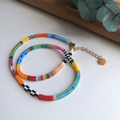 Elevate your summer style with this handmade colorful beaded necklace, perfect for adding a vibrant touch to your everyday look. 🌞 Crafted with attention to detail, this boho-inspired necklace is designed to be both trendy and versatile. RIO necklace is a unique jewelry that takes hours to make. I tried to create a wonderful harmony by combining different colors. In this way, you can combine it with any color of your clothes! I made this unique necklace with high quality Miyuki Beads  (not sead Colorful Letter Beads For Festival, Festival Multicolor Letter Beads, Rainbow Letter Beads For Festival, Vibrant Handmade Multicolor Beaded Bracelets, Vibrant Colorful Beaded Bracelets For Festival, Multicolor Beads For Summer Jewelry Making, Vibrant Beaded Beach Necklaces, Colorful Vibrant Beaded Necklace With Round Beads, Vibrant Beaded Beach Necklace