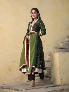 This is a beautiful 3-piece set. The set comes with hand work & gota detailing kurta has round neck, calf length and 3/4th sleeves teamed with trouser pants and a tie-dye organza dupatta. Total No of Set-3 Kurta Fabric: Chanderi Bottom Fabric - Chanderi Dupatta Fabric-Organza Work Done - Hand work & gota detailing. Sleeve Length: 3/4th Sleeves Neck: Round Neck Style: Anarkali set Color: Green Occasion: Party Wear Washing Instructions: Hand Wash or Dry Clean Semi-stitched Long Anarkali Kurta, Cutdana Sets With Straight Kurta For Navratri, Anarkali Style Long Sleeve Palazzo Set For Festivals, Navratri Sets With Straight Kurta And Cutdana, Navratri Sets With Cutdana And Straight Kurta, Long Sleeve Palazzo Set For Festivals, Diwali Cutdana Straight Kurta Set, Diwali Straight Kurta Set With Cutdana, Semi-stitched Long Palazzo Set For Navratri