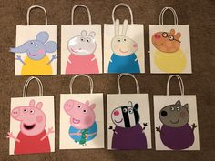 five bags with peppa pig and other cartoon characters are on the floor next to each other