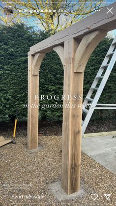 a wooden arbor with the words progress on it