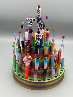 a multicolored cake with lots of different items on it