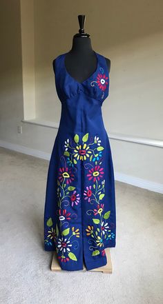 Vintage Blue Embroidered Dresses, Blue Sleeveless Maxi Dress With Floral Embroidery, Embroidered Blue Maxi Dress For Summer, Blue Embroidered Floor-length Maxi Dress, Blue Cotton Maxi Dress With Floral Embroidery, Fitted Embroidered Blue Maxi Dress, Fitted Blue Embroidered Maxi Dress, Blue Sleeveless Vintage Maxi Dress, Blue Fitted Maxi Dress With Embroidery