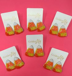 These cute oversized stud candy corn earrings are so fun to wear for all of your Halloween festivities. Wear with a solid top or dress or pair with a fun Queen of Sparkles top. Length: 2 inches Post Back Lightweight Nickel Free Corn Earrings, Candy Corn Earrings, Queen Of Sparkles, Sparkle Top, Halloween Festivities, Halloween Earrings, Candy Corn, Seed Beads, Corn