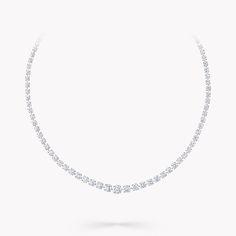 A hypnotic display of round diamonds in platinum and white gold are deftly arranged into a scintillating stream of brilliance in this necklace from the Classic Graff collection. Perfectly suited to day or evening wear, each diamond within this design is set within a minimal metal setting to allow its radiance to powerfully emanate. The Classic Graff collection celebrates the purity and fire of the finest Graff diamonds showcased in truly timeless jewels and eternally elegant silhouettes. An eleg Diamond Drop Pendant, Graff Diamonds, Round Diamond Pendant, Rare Diamond, Necklaces Diamond, Graduation Necklace, Diamond Pendants, Fine Diamond Jewelry, Diamond Necklaces