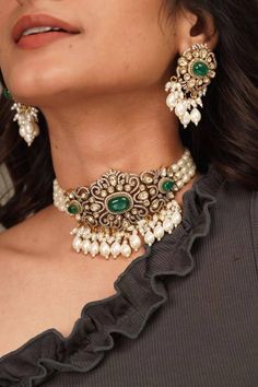 Gorgeous Sabyasachi inspired Victorian Necklace with matching Dangle earrings. Studded with Emerald colored Onyx Stones and Faux CZ Diamond AAA quality stones. All Handmade! Green stones are and white tiny ones of high quality cubic zirconia. Metal: Pure silver mix brass. Silver content around 20%. Black rhodium plated. This choker is flexible and takes the shape of the neck. Fine quality and craftsmanship. Perfect for desi/ Indian/ Pakistani/weddings. Necklace comes in drawstring cord therefore Elegant Wedding Earrings With Motifs, Elegant Chandbali Bridal Necklace With Latkans, Elegant Bridal Necklace With Latkans For Party, Elegant Bridal Necklace With Motifs For Wedding, Elegant Bridal Necklace With Latkans For Reception, Elegant Party Bridal Necklace With Latkans, Elegant Kundan Bridal Necklace With Motifs, Elegant Kundan Chandbali Necklace With Motifs, Elegant Necklaces With Motifs For Celebration