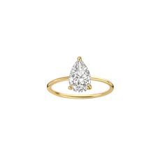 a yellow gold ring with a pear shaped diamond