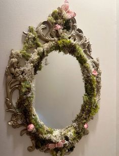 a mirror that has some flowers on it