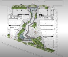 an aerial view of the ground plan for a building with trees and bushes on it