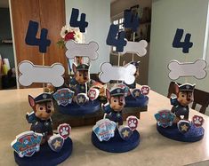 paw patrol birthday cake toppers on a table