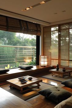 a living room filled with lots of furniture next to a large window covered in bamboo blinds