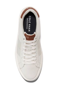 This sporty and stylish sneaker is a comfortable footwear staple you'll want to wear with every outfit. Cushioned insole White sole Leather upper/textile and leather lining/rubber sole Imported Mens Stylish Sneakers, Men’s Everyday Shoes, Cream Lace-up Walking Sneakers, White Ortholite Insole Slip-on Sneakers, Men’s Trendy Sneakers 2024, Classic White Low-top Golf Shoes, Casual White Slip-on Sneakers With Ortholite Insole, White Lace-up Walking Shoes With Perforated Toe Box, Casual White Slip-on Walking Shoes