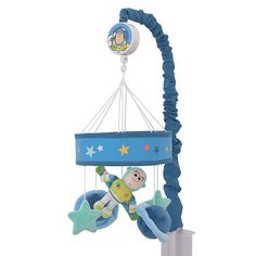 a baby crib mobile with a toy on it