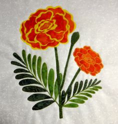 two flowers on a white background with green leaves