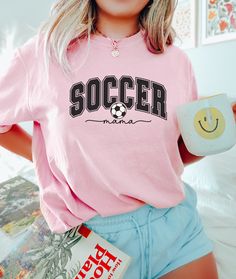 Soccer Mom Shirt, Sports Parent Shirt, Soccer Lover, Cute Soccer Shirt, Soccer Mom T-shirt, Mom Shirt, Soccer Mom Gift, Soccer Mom Tee 🌸Material: Crafted with 6.1 oz/yd² of premium 100% Ring Spun US cotton, ensuring superior quality and comfort. 🌸Fit: Features a relaxed fit that is both comfortable and stylish, suitable for all genders and sizes. 🌸Collar: Equipped with a topstitched, classic width, rib collar for a timeless and refined look. 🌸Sizing: Runs true to size, providing a consistent Pink Crew Neck T-shirt For Sports Events, Sporty Pink T-shirt With Screen Print, Sports Team Name Pink T-shirt, Pink Short Sleeve Sports T-shirt, Short Sleeve Sports Shirt With Text Print, Pink Sports T-shirt With Graphic Print, Pink Sports Shirt With Graphic Print, Sports Crew Neck T-shirt With Comfortable Fit, Crew Neck Tops With Slogan For Sports Season