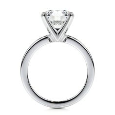 a white diamond engagement ring on a white background