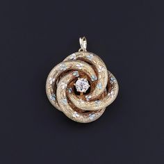 The love knot motif, a popular design since ancient times, was commonly used throughout the late 19th and early 20th centuries to symbolize the entwined heart of lovers or friends. This 14k gold love knot was originally a brooch (circa 1890).  It features blue and white enamel forget-me-not flowers and a 0.33ct old European cut diamond at its center.  The diamond is I color, SI1 clarity.  The pendant weighs 5.69 grams, and it is in excellent condition.  We have many other fantastic offerings of Jewelry Post, Love Knot, European Cut Diamonds, Antique Diamond, Forget Me Not, Antique Shops, Ancient Times, White Enamel, Diamond Pendant