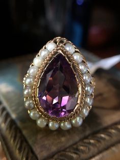 14k yellow gold amethyst and seed pearl ring circa the 1940's.  This antique treasure will most definitely get the conversion started.  14x9mm amethyst with 3mm seed pearl halo.  Finger size 7 Pearl Halo, Seed Pearl Ring, Ariana Grande Style, Seed Pearl, Pearl Ring, Rings Statement, Ariana Grande, Statement Rings, Halo