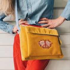 "I love this color!! A modern take on velvet!!  it was love at first sight when I saw this mustard yellow velvet fabric while traveling. Lined for beautiful structure and body, this unique bag is definitely something special!  Big pocket on front allows for quick phone storage and has a Velcro closure.  Fun pineapple cotton poly fabric lining. The denim straps are Upcycled denim and the straps are adjustable to make a longer or shorty crossbody bag. Free Spirit patch on the front! Measures 10.5\" x 12.5\"" Vintage Yellow Shoulder Bag For Daily Use, Vintage Yellow Tote Shoulder Bag, Vintage Yellow Shoulder Bag, Vintage Yellow Bag With Removable Pouch, Vintage Yellow Crossbody Bag, Vintage Yellow Shoulder Bag With Adjustable Strap, Vintage Yellow Bag For Everyday Use, Retro Satchel With Zipper Pocket, Yellow Retro Shoulder Bag For Everyday Use