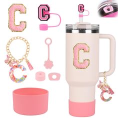 pink and white travel mug with initial charms, keychains, bracelets, ring, bottle opener