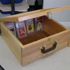 a wooden box filled with cards on top of a table