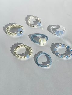 (items are shipped between 1-2 days)   Cute beaded stretchy rings made with blue beads and/ or pearls 💗I recommend avoiding water and keeping it stored away when not being worn to maintain its quality. Pearl Beaded Ring, Preppy Beaded Rings, Aesthetic Beads Ring, Aesthetic Bead Rings, Ring Ideas With Beads, Preppy Seed Bead Rings, Simple Seed Bead Patterns, Cute Diy Rings, Bracelets Handmade Beaded Diy Jewelry