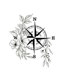 a compass with flowers on it and the word w e s written in black ink