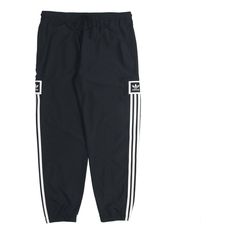 Sporty Joggers With Three Stripes And Relaxed Fit, Adidas Sporty Relaxed Fit Pants, Relaxed Fit Three Stripes Joggers For Sports, Adidas Sporty Relaxed Fit Joggers, Sports Pants With Three Stripes And Relaxed Fit, Adidas Black Nylon Bottoms, Adidas Sportswear Bottoms With Elastic Side Panels, Adidas Relaxed Fit Bottoms For Jogging, Black Nylon Adidas Bottoms