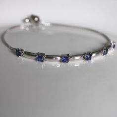 This sterling silver 3 mm Blue Sapphire Gemstone Bolo Bracelet is simply elegant. She'll love the versatility this bracelet offers as it pairs amazingly with fine fashion and casual wear. The bracelet is comfortable and easy to adjust to your liking with the pull tie and ball clasp. A thoughtful gift for a September Birthday and a variety of other occasions and events. Explore All Of Our Timeless Jewelry: https://www.etsy.com/shop/JOHNWESHDESIGNS All JohnWeshDesigns jewelry is handcrafted and de Classic Blue Jubilee Bracelet, Sapphire Sterling Silver Jubilee Tennis Bracelet, Blue Birthstone Bracelets In Fine Jewelry Style, Elegant Adjustable Sterling Silver Birthstone Bracelet, Adjustable Blue Bracelets For Anniversary, Sapphire Sterling Silver Tennis Bracelet, Blue Birthstone Bracelets Fine Jewelry, Classic Blue Bracelet Jewelry, Classic Blue Sterling Silver Tennis Bracelet